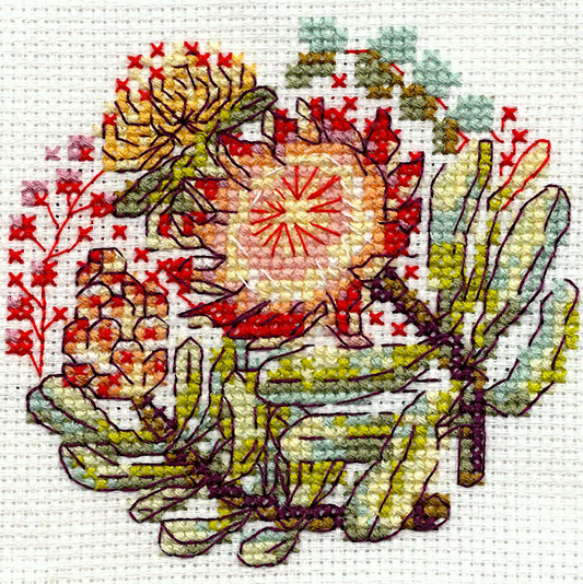 A close-up of a protea cross-stitch design on white Aida fabric - the complete stitch
